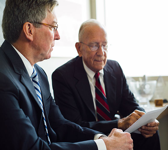 Bill Zorn and Jack Middleton reviewing document